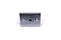 Adapter - Piasta noża do kosiarek DYM i TORQ CZKSI-0203 w kolorze metalicznym, prostokątny kształt z jednym centralnym otworem i dwoma bocznymi otworami na mocowanie. Widok frontalny na jasno oświetlonym tle, produkt leży poziomo.