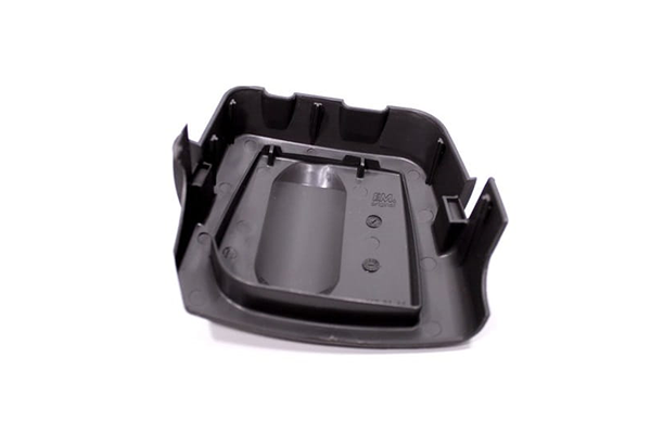 Osłona filtra powietrza do kosy spalinowej Husqvarna 333R / 535RX, czarna, plastikowa, o kształcie prostokątnym z wklęśnięciem na filtr. Widok z góry, pokazujący mocowania i detale wewnętrzne, na jednolitym tle.