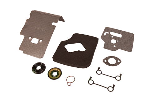 Zestaw uszczelek do kosy Husqvarna 124/125RJ/128L, różne kształty uszczelek, metalowe żarówki i pierścień, uszczelki matowe, elementy metalowe błyszczące, na szarym tle.