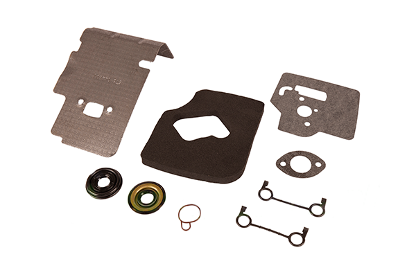 Zestaw uszczelek do kosy Husqvarna 124/125RJ/128L, różne kształty uszczelek, metalowe żarówki i pierścień, uszczelki matowe, elementy metalowe błyszczące, na szarym tle.