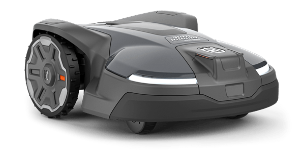 Robot koszący Husqvarna Automower® 450X NERA, ciemnoszary, zaokrąglony kształt, przód z LED, duże teksturowane koła, prezentowany z lekko uniesionym przodem na przezroczystym tle.
