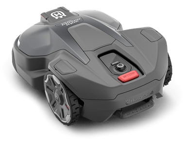 Robot koszący Husqvarna Automower® 430X NERA w kolorze szarym. Wyprofilowany kształt z logo na górze i przyciskiem uruchamiającym z przodu. Widoczne koła z głębokim bieżnikiem. Zbliżenie pozwala dostrzec detale obudowy i teksturę materiału.