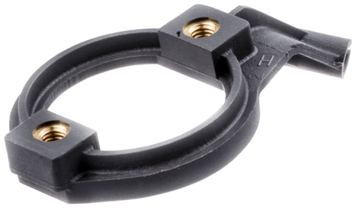 Kołnierz gaźnika do pilarek Husqvarna 385, 390XP, czarny, z gwintami i mocowaniami, widok z bliska ukazujący detale, solidny, uniwersalny, do narzędzi ogrodowych.