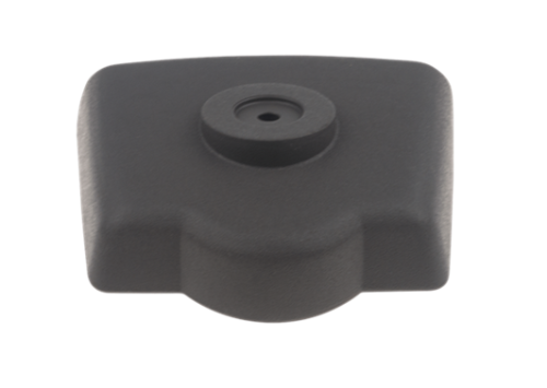 Pokrywa filtra nożyc w kolorze czarnym, wykonana z tworzywa sztucznego. Produkt widoczny z góry, o prostokątnym kształcie z wypustką na środku. Gładka tekstura, brak widocznych napisów i logo. Idealna do modeli Husqvarna 323HD60/325HD60.