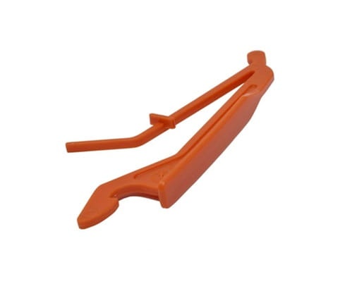 Pomarańczowa blokada dźwigni gazu nożyc Husqvarna 123HD60/323HD60, z tworzywa, pozioma, z zaciskiem i uchwytem, matowa, gładkie krawędzie, do precyzyjnego ustawienia dźwigni gazu.