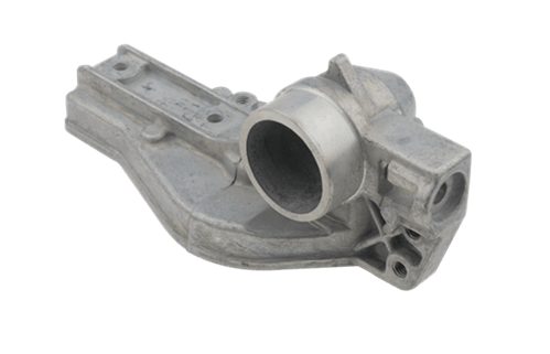 Obudowa przekładni nożyc 323HE3/325HDA55 Husqvarna w kolorze srebrnym, wykonana z metalu, z widocznym otworem montażowym. Ujęcie z boku, prezentujące detal i kształt elementu mechanicznego. Bez napisów lub logo.