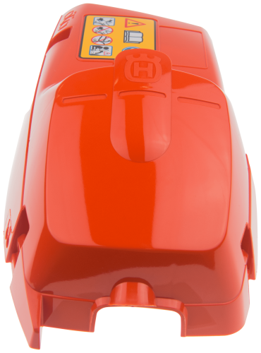 Pomarańczowa plastikowa pokrywa cylindra pilarki Husqvarna 357XP z logo i oznaczeniami bezpieczeństwa, gładka i błyszcząca, widoczna z przodu.