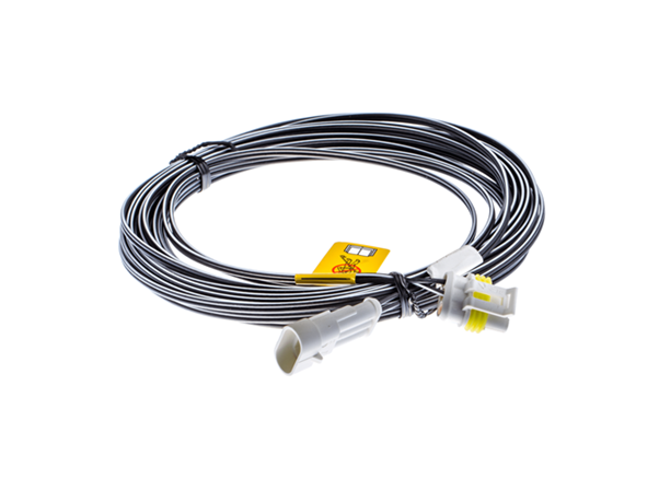 Czarny przewód niskonapięciowy 10 m z białymi złączkami i żółtą etykietą ostrzegawczą, przeznaczony do stacji ładującej Husqvarna Automower.