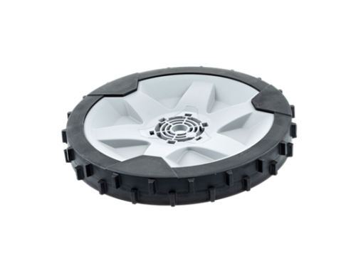 Koło tylne kosiarki Automower 420/440/520/550 Husqvarna w kolorze szaro-czarnym. Zbliżenie na owalny kształt z pięcioma wycięciami, gumowym bieżnikiem oraz centralnym otworem wentylacyjnym. Produkt leży poziomo na jednolitym tle.