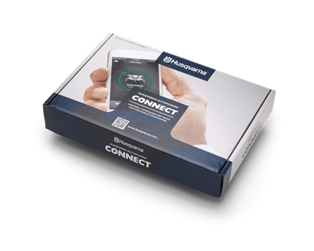Zestaw Husqvarna Automower Connect KIT 2G + 4G w białym opakowaniu. Na górze widoczny ekran smartfona z napisem CONNECT oraz ikona zarządzania robotem koszącym. Po bokach logo Husqvarna. Ujęcie z lekkiego kąta, opakowanie leży na neutralnym tle.