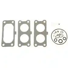 Zestaw uszczelek wykaszarki 129R Husqvarna, składający się z trzech uszczelek o metalicznym wykończeniu i jednego okrągłego elementu z otworami. Uszczelki mają różne rozmiary, ułożone płasko na jasnym tle, idealne do naprawy urządzenia.