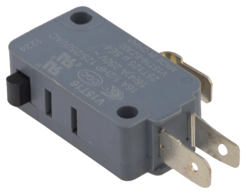 Szary wyłącznik ridera R213C Husqvarna, prostokątny, z dwoma stalowymi pinami i otworami montażowymi. Na górze widoczne napisy i oznaczenia. Zdjęty pod kątem, leżący na płaskiej powierzchni.