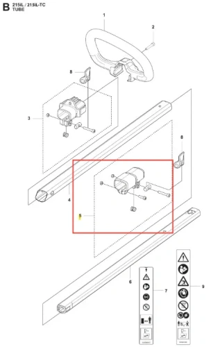 Złączka podkaszarki 215iL Husqvarna, metalowa, z widocznymi mocowaniami i złączem, umieszczona w orientacji poziomej. Element otaczający złącze jest prostokątny, a całość wyróżnia się prostą, funkcjonalną estetyką. Tło jest jednolite.