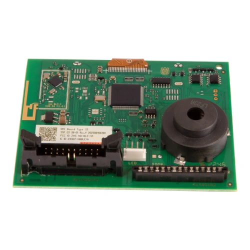 Wyświetlacz robota koszącego Automower 310 Mark II Husqvarna. Zielona płytka drukowana z układami scalonymi, złączami i czarnym okrągłym przetwornikiem. Widok frontalny, szczegóły komponentów i oznaczenia.