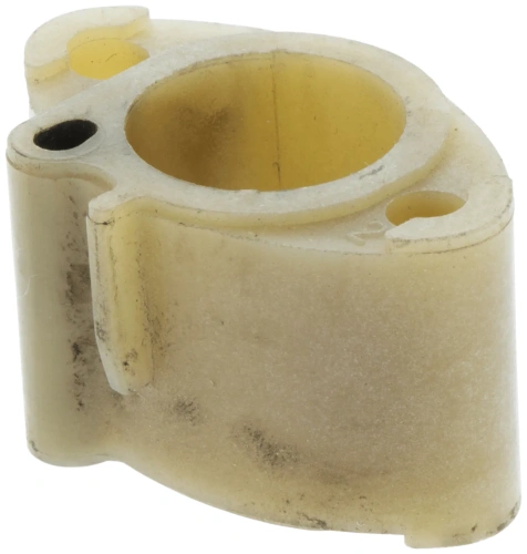 Kolektor pilarki Husqvarna 262XP w kolorze jasnym, z przezroczystym wykończeniem. Z uwagi na kąt ujęcia, wyraźnie widoczne otwory montażowe oraz zaokrąglone krawędzie. Element leżący na neutralnym tle.