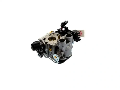 Gaźnik do piły Husqvarna 550XP Mark II/550XPG Mark II w kolorze szarym, z podwójnymi otworami wlotowymi. Widok z boku, z zamontowaną wtyczką elektryczną. Elementy metalowe, z widocznymi mocowaniami. Idealny do naprawy pił łańcuchowych.