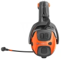 Ochronniki słuchu X-COM Active Husqvarna w kolorze czarnym z pomarańczowymi akcentami. Ujęcie z boku, produkt z widocznym mikrofonem i przyciskami głośności. Wygodne nauszniki idealne do używania na zewnątrz czy w głośnym otoczeniu.