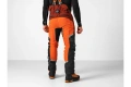 Spodnie ochronne Technical Extreme  Husqvarna, pomarańczowe z czarnymi detalami, tylny widok. Solidny materiał, logo na plecach, boczne kieszenie i regulowane mankiety. Idealne do pracy w terenie.