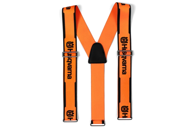 Szelki do spodni HUSQVARNA w intensywnym pomarańczowym kolorze z czarnymi akcentami. Produkt złożony w kształcie litery X, z metalowymi klamrami i logo Husqvarna. Widoczny wzór na pasach. Idealne do użytku roboczego lub outdoorowego.