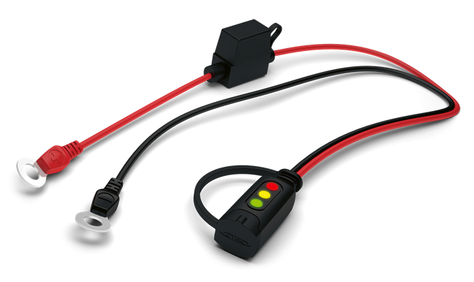 Wskaźnik naładowania akumulatora Husqvarna z czerwonymi i czarnymi przewodami, diodowy wskaźnik z zieloną, żółtą i czerwoną diodą na czarnym tle, widok frontalny.